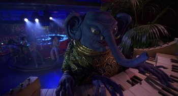 Movie still from “Monkeybone” (2001), directed by Henry Selick – An image of an elephant playing the piano; Medium shot, High angle