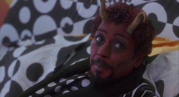 Movie still from “Monkeybone” (2001), directed by Henry Selick – A man with horns on his head and face; Close Up shot, High angle