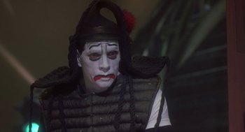 Movie still from “Monkeybone” (2001), directed by Henry Selick – A person wearing a costume; Close Up shot, Over the shoulder angle