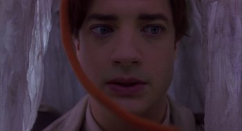 Movie still from “Monkeybone” (2001), directed by Henry Selick – A young man is looking into the camera; Close Up shot, Overhead angle