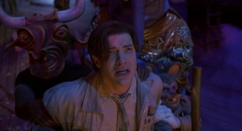 Movie still from “Monkeybone” (2001), directed by Henry Selick – A man in a crowd of people looking up at the ceiling; Close Up shot, Low angle