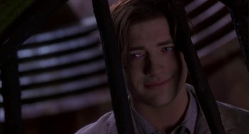 Movie still from “Monkeybone” (2001), directed by Henry Selick – A man's face in a dark room; Close Up shot, Low angle