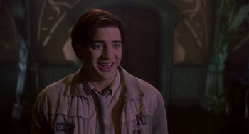 Movie still from “Monkeybone” (2001), directed by Henry Selick – A young man smiles while wearing a jacket; Close Up shot, Low angle