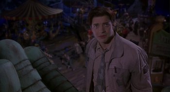 Movie still from “Monkeybone” (2001), directed by Henry Selick – A man standing in front of a crowd of people; Medium shot, Low angle
