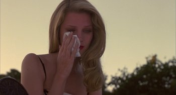 Movie still from “Monkeybone” (2001), directed by Henry Selick – A woman wipes her face with a tissue; Close Up shot, Low angle