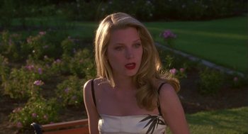 Movie still from “Monkeybone” (2001), directed by Henry Selick – A woman with long blonde hair wearing a white top; Close Up shot, Over the shoulder angle