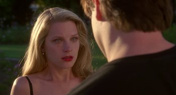 Movie still from “Monkeybone” (2001), directed by Henry Selick – A woman with red lipstick looking at a man with blond hair; Close Up shot, Over the shoulder angle