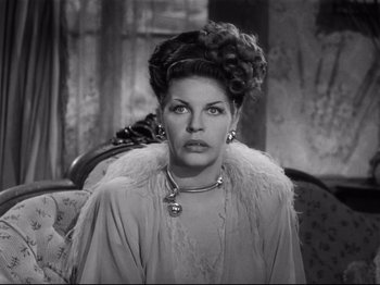 Movie still from “Monsieur Verdoux” (1947), directed by Charles Chaplin – An old photo of a woman in a fur coat; Close Up shot, Low angle