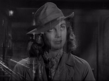 Movie still from “Monsieur Verdoux” (1947), directed by Charles Chaplin – A black and white photo of a woman wearing a hat; Close Up shot, Low angle