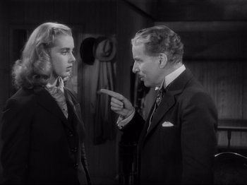 Movie still from “Monsieur Verdoux” (1947), directed by Charles Chaplin – A man and a woman are talking to each other; Medium shot, Over the shoulder angle