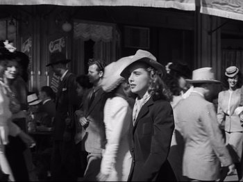 Movie still from “Monsieur Verdoux” (1947), directed by Charles Chaplin – Black and white photograph of a crowd of people walking down a street; Wide shot, High angle