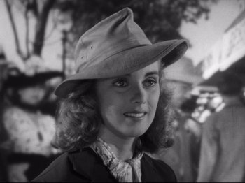 Movie still from “Monsieur Verdoux” (1947), directed by Charles Chaplin – A black and white photo of a woman wearing a hat; Close Up shot, High angle
