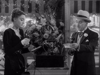 Movie still from “Monsieur Verdoux” (1947), directed by Charles Chaplin – A man and a woman standing next to each other; Medium shot, Low angle