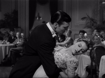 Movie still from “Monsieur Verdoux” (1947), directed by Charles Chaplin – A black and white photo of a man and a woman; Medium shot, Low angle