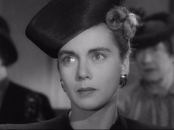 Movie still from “Monsieur Verdoux” (1947), directed by Charles Chaplin – A black and white photo of a woman in a hat; Close Up shot, Low angle