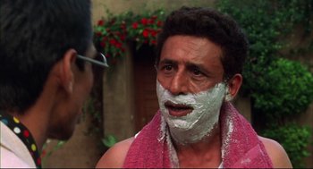 Movie still from “Monsoon Wedding” (2001), directed by Mira Nair – A man with shaving cream on his face; Close Up shot, Low angle