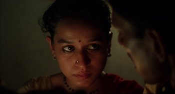 Movie still from “Monsoon Wedding” (2001), directed by Mira Nair – A person with a nose ring; Close Up shot, High angle