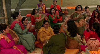 Movie still from “Monsoon Wedding” (2001), directed by Mira Nair – A group of women sitting around each other; Wide shot, High angle