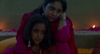 Movie still from “Monsoon Wedding” (2001), directed by Mira Nair – A woman and a girl are posing for a picture; Close Up shot, High angle