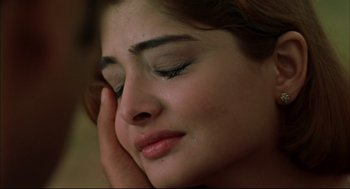 Movie still from “Monsoon Wedding” (2001), directed by Mira Nair – A person with their eyes closed; Extreme Close Up shot, High angle