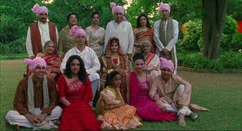 Movie still from “Monsoon Wedding” (2001), directed by Mira Nair – A group of people dressed in different outfits; Wide shot, High angle