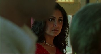 Movie still from “Monsoon Wedding” (2001), directed by Mira Nair – A person wearing a red dress; Close Up shot, Over the shoulder angle