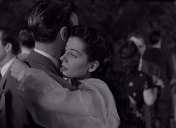 Movie still from “Moonrise” (1948), directed by Frank Borzage – A man and a woman embracing each other; Close Up shot, Low angle