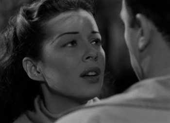 Movie still from “Moonrise” (1948), directed by Frank Borzage – A woman is looking at a man with a cigarette in her mouth; Close Up shot, High angle