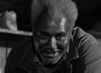 Movie still from “Moonrise” (1948), directed by Frank Borzage – A black and white photo of a man with a beard; Close Up shot, Low angle