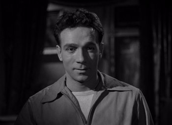 Movie still from “Moonrise” (1948), directed by Frank Borzage – A black and white photo of a man in a jacket; Close Up shot, High angle