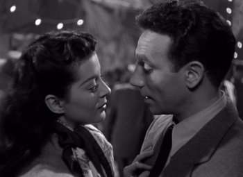 Movie still from “Moonrise” (1948), directed by Frank Borzage – A man and a woman looking into each others eyes; Close Up shot, High angle