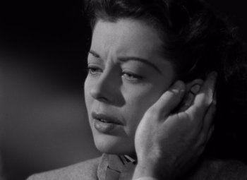 Movie still from “Moonrise” (1948), directed by Frank Borzage – An old black and white photo of a woman on a cell phone; Close Up shot, Low angle