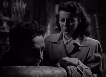 Movie still from “Moonrise” (1948), directed by Frank Borzage – An old photo of a man and a woman looking at each other; Close Up shot, Low angle