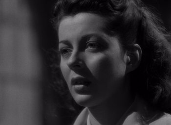 Movie still from “Moonrise” (1948), directed by Frank Borzage – A black - and - white photo of a woman's face; Close Up shot, Low angle