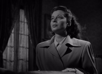 Movie still from “Moonrise” (1948), directed by Frank Borzage – A black and white photo of a woman looking up at the sky; Medium shot, Low angle