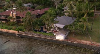 Movie still from “Morning Light” (2008), directed by Mark Monroe – An aerial view of a house on the water; Extreme Wide shot, High angle