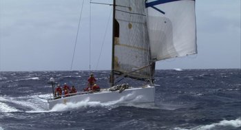 Movie still from “Morning Light” (2008), directed by Mark Monroe – A group of people on a sail boat in the ocean; Extreme Wide shot, High angle