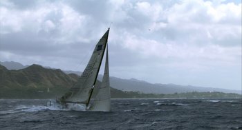 Movie still from “Morning Light” (2008), directed by Mark Monroe – A sailboat in the ocean with a cloudy sky in the background; Extreme Wide shot, Low angle