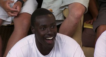 Movie still from “Morning Light” (2008), directed by Mark Monroe – A person with a smile on his face; Close Up shot, High angle