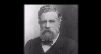 Movie still from “Morning Light” (2008), directed by Mark Monroe – An old black and white photo of a man with a long beard; Close Up shot, Low angle