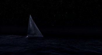 Movie still from “Morning Light” (2008), directed by Mark Monroe – A sailboat in the middle of the ocean at night; Extreme Wide shot, High angle