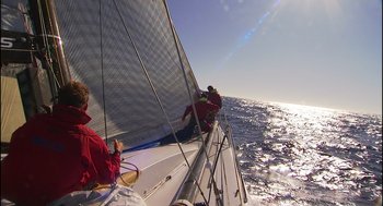 Movie still from “Morning Light” (2008), directed by Mark Monroe – Two people on a sailboat in the water; Extreme Wide shot, Low angle