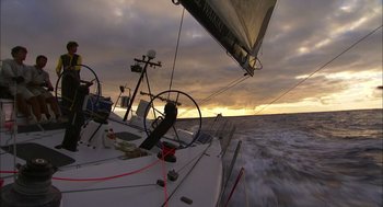 Movie still from “Morning Light” (2008), directed by Mark Monroe – A sailboat in the water at sunset; Extreme Wide shot, Low angle