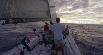Movie still from “Morning Light” (2008), directed by Mark Monroe – A group of people on a sailboat in the ocean; Extreme Wide shot, High angle