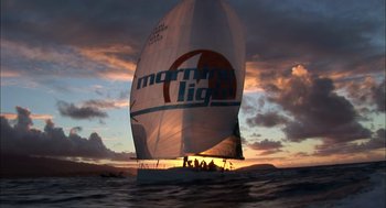 Movie still from “Morning Light” (2008), directed by Mark Monroe – A sailboat sailing on the ocean at sunset; Extreme Wide shot, Low angle