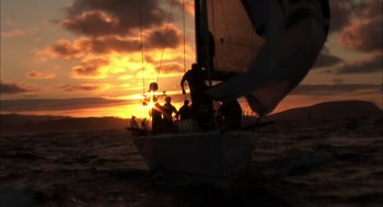 Movie still from “Morning Light” (2008), directed by Mark Monroe – A group of people sitting on a boat in the water; Extreme Wide shot, Low angle