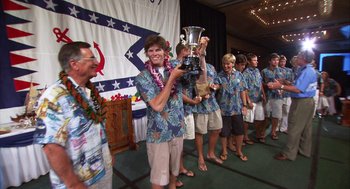 Movie still from “Morning Light” (2008), directed by Mark Monroe – A group of young men standing next to each other holding a trophy; Wide shot, Low angle