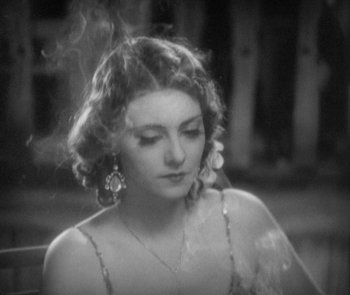 Movie still from “Morocco” (1930), directed by Josef von Sternberg – A black - and - white photo of a woman in a dress; Close Up shot, High angle