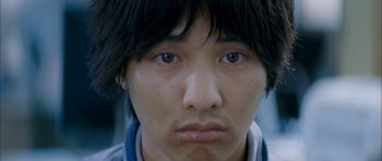 Movie still from “Mother” (2009), directed by Bong Joon Ho – A person's eyes and face; Close Up shot, Low angle