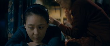 Movie still from “Mother” (2009), directed by Bong Joon Ho – A woman sitting in front of another woman; Close Up shot, Over the shoulder angle